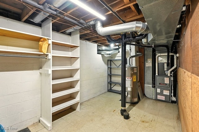 3692 Orchard St, Mogadore, OH 44260 - unfinished below grade area featuring water heater, heating unit, and tile patterned floors