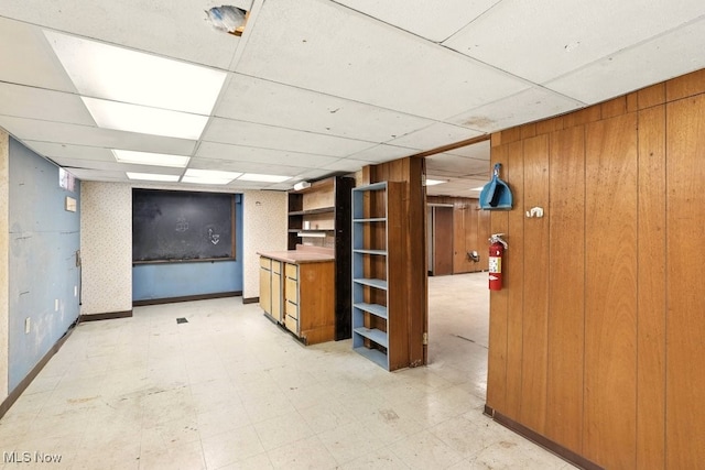 3692 Orchard St, Mogadore, OH 44260 - finished basement with a drop ceiling, wooden walls, and light floors