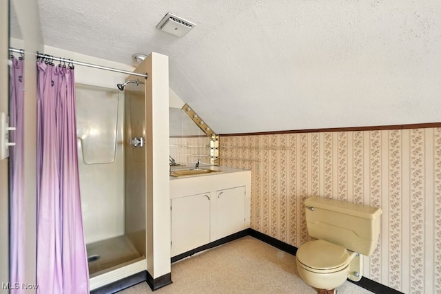 3692 Orchard St, Mogadore, OH 44260 - bathroom featuring a shower stall, vanity, a textured ceiling, and wallpapered walls