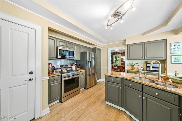 6735 Wakefield Rd, Hiram, OH 44234 - kitchen with appliances with stainless steel finishes, gray cabinetry, and light wood-style flooring