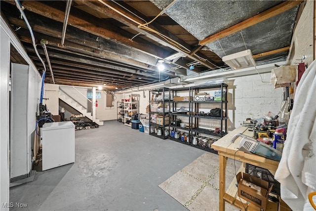 6735 Wakefield Rd, Hiram, OH 44234 - unfinished basement with refrigerator and stairs