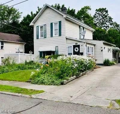134 E Summit St, Alliance, OH 44601 - traditional-style house with a chimney