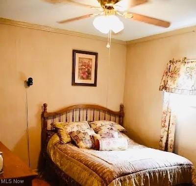 134 E Summit St, Alliance, OH 44601 - bedroom with ornamental molding and a ceiling fan