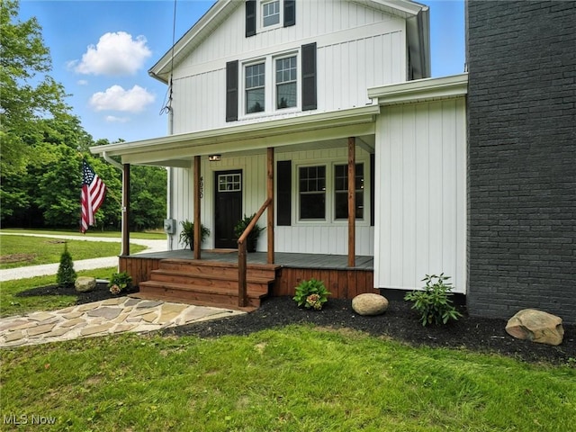 4930 S Ridge Rd W, Ashtabula, OH 44004 - view of front of property featuring a porch and a front lawn