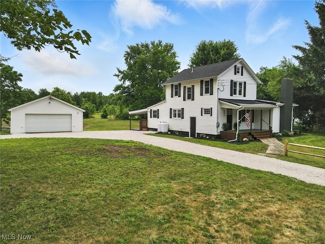 4930 S Ridge Rd W, Ashtabula, OH 44004 - view of front facade with a porch, an outdoor structure, a detached garage, and a front lawn
