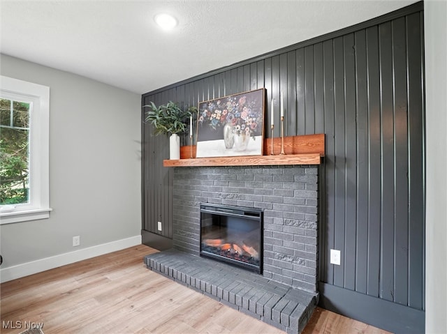 4930 S Ridge Rd W, Ashtabula, OH 44004 - living room with a fireplace, wood finished floors, and wooden walls