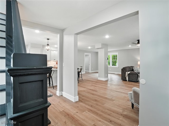 4930 S Ridge Rd W, Ashtabula, OH 44004 - hall with light wood-type flooring, stairway, and recessed lighting