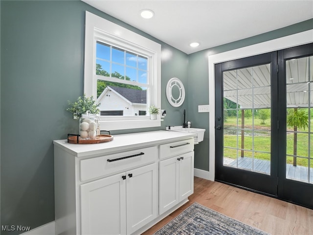 4930 S Ridge Rd W, Ashtabula, OH 44004 - bathroom featuring wood finished floors, vanity, and recessed lighting