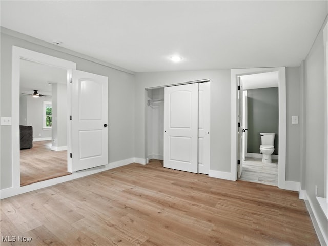 4930 S Ridge Rd W, Ashtabula, OH 44004 - unfurnished bedroom with light wood-type flooring, a closet, ensuite bathroom, and recessed lighting