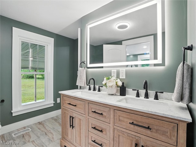 4930 S Ridge Rd W, Ashtabula, OH 44004 - bathroom with marble look tile flooring and double vanity