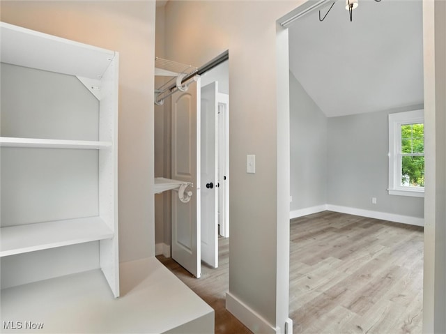 4930 S Ridge Rd W, Ashtabula, OH 44004 - bathroom featuring wood finished floors and vaulted ceiling