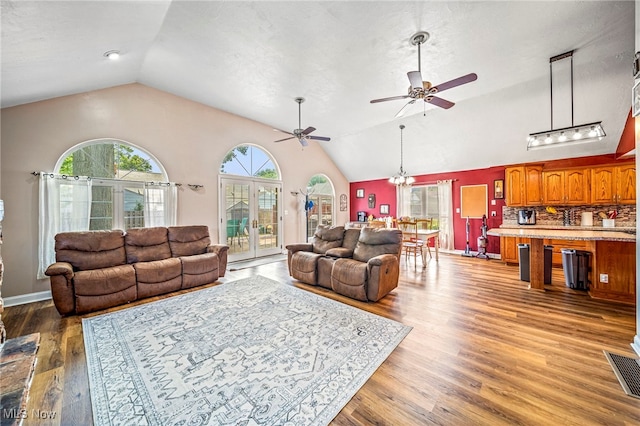 1743 Silver St, Wickliffe, OH 44092 - living room featuring lofted ceiling, ceiling fan, and wood finished floors