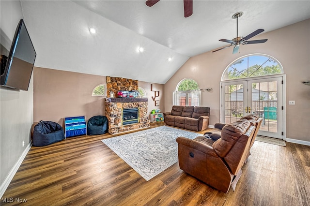 1743 Silver St, Wickliffe, OH 44092 - living room with a ceiling fan, wood finished floors, lofted ceiling, a fireplace, and french doors