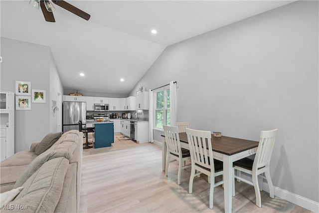 4933 Lear Nagle Rd, North Ridgeville, OH 44039 - dining area featuring light wood-style flooring, ceiling fan, recessed lighting, and high vaulted ceiling