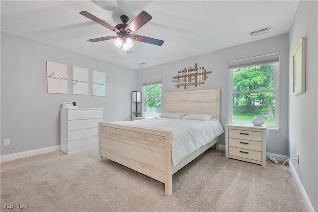 4933 Lear Nagle Rd, North Ridgeville, OH 44039 - bedroom featuring multiple windows, carpet, and a ceiling fan