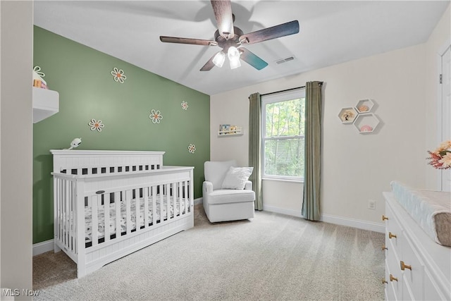 4933 Lear Nagle Rd, North Ridgeville, OH 44039 - carpeted bedroom featuring a crib and a ceiling fan