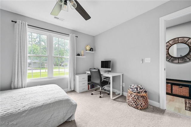 4933 Lear Nagle Rd, North Ridgeville, OH 44039 - bedroom with light colored carpet, ceiling fan, and an office area