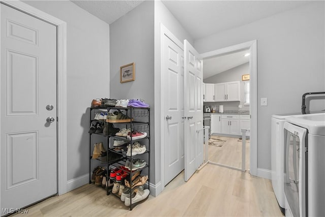 4933 Lear Nagle Rd, North Ridgeville, OH 44039 - laundry room featuring washer and clothes dryer and light wood-style flooring