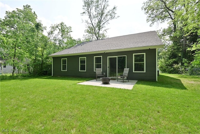 4933 Lear Nagle Rd, North Ridgeville, OH 44039 - rear view of house with a patio and a yard