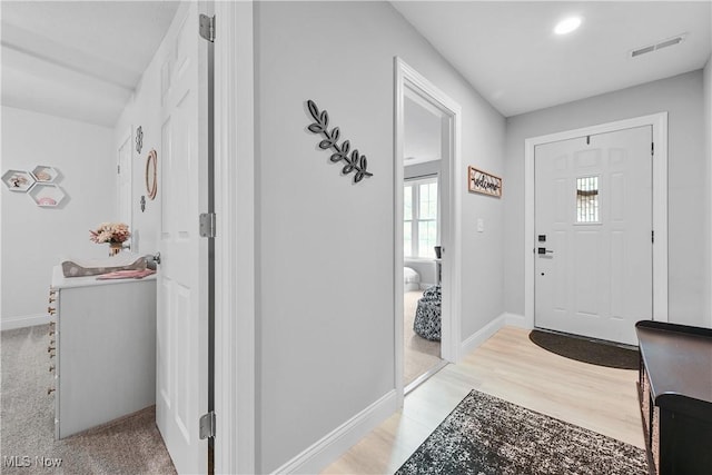 4933 Lear Nagle Rd, North Ridgeville, OH 44039 - foyer entrance with healthy amount of natural light and light wood finished floors