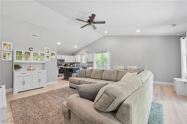 4933 Lear Nagle Rd, North Ridgeville, OH 44039 - living room featuring ceiling fan, light wood-style floors, recessed lighting, and high vaulted ceiling