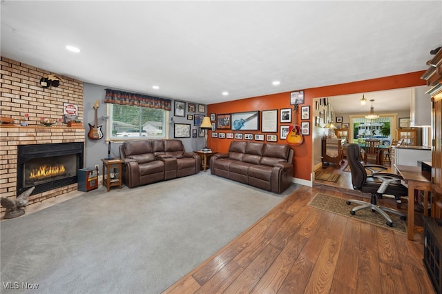 25171 Doe Dr, North Olmsted, OH 44070 - living area featuring wood-type flooring, a fireplace, and recessed lighting