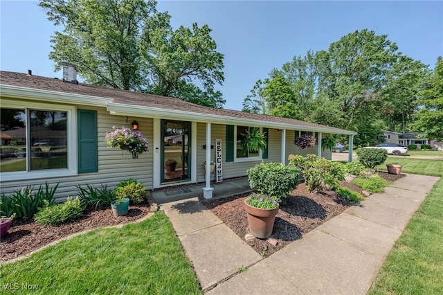 25171 Doe Dr, North Olmsted, OH 44070 - view of front of property featuring covered porch and a front lawn