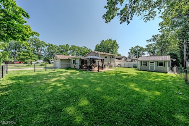 25171 Doe Dr, North Olmsted, OH 44070 - fenced backyard featuring a gazebo, a storage shed, a gate, and a patio