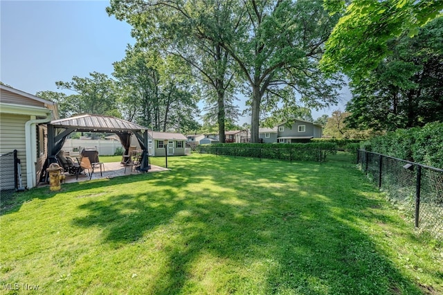 25171 Doe Dr, North Olmsted, OH 44070 - fenced backyard with a gazebo, a patio area, and an outdoor structure