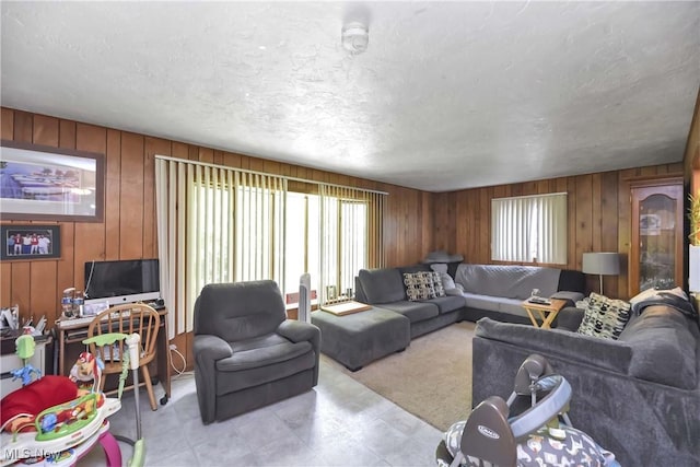 4480 W 224th St, Fairview Park, OH 44126 - living area with wooden walls and a textured ceiling