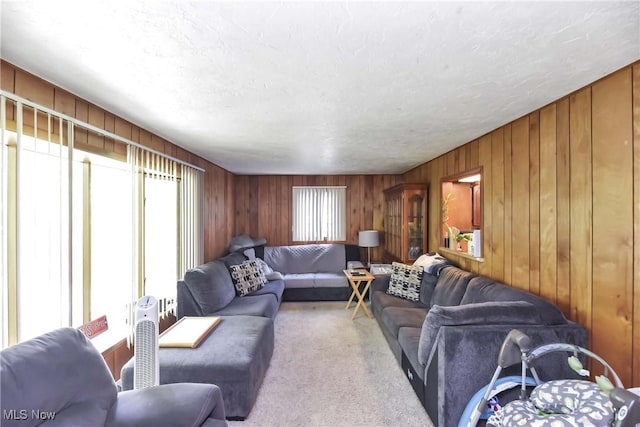4480 W 224th St, Fairview Park, OH 44126 - carpeted living area featuring healthy amount of natural light and wood walls