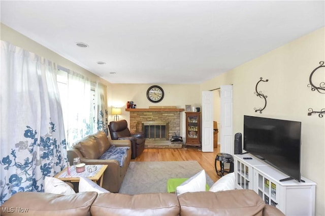 4480 W 224th St, Fairview Park, OH 44126 - living area featuring light wood-type flooring and a fireplace