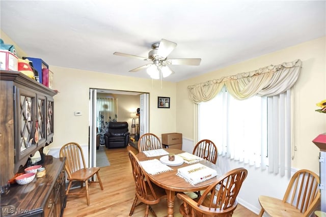 4480 W 224th St, Fairview Park, OH 44126 - dining room featuring light wood-style flooring and ceiling fan