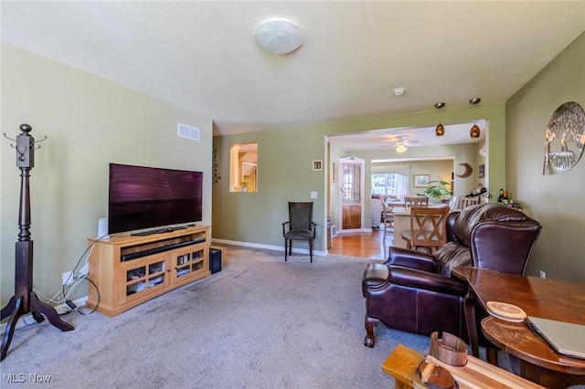 4959 Anderson Rd, Lyndhurst, OH 44124 - carpeted living room featuring baseboards and ceiling fan