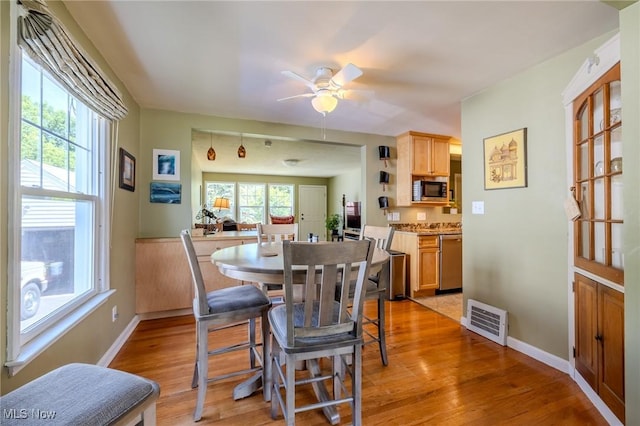 4959 Anderson Rd, Lyndhurst, OH 44124 - dining room featuring light wood-style flooring and a ceiling fan