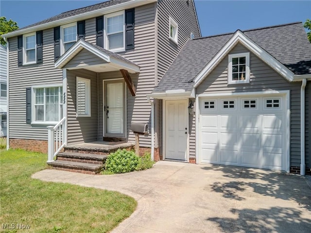 4959 Anderson Rd, Lyndhurst, OH 44124 - traditional-style house featuring a garage, driveway, a shingled roof, and a front lawn