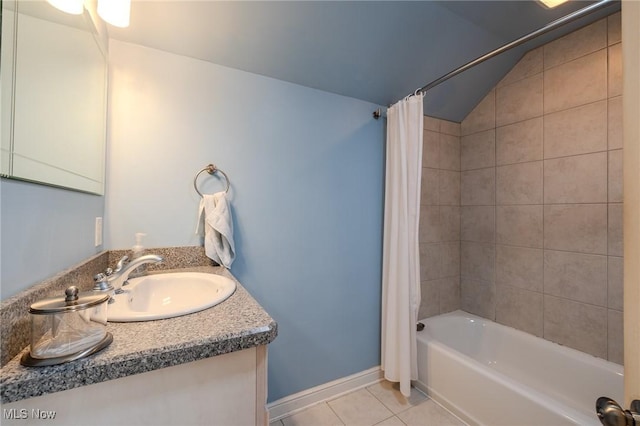 4959 Anderson Rd, Lyndhurst, OH 44124 - bathroom with tile patterned floors, vanity, shower / tub combo with curtain, and vaulted ceiling