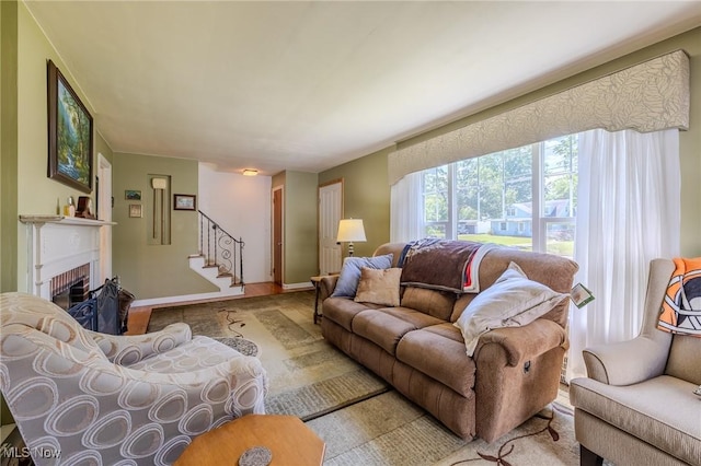 4959 Anderson Rd, Lyndhurst, OH 44124 - living area featuring stairs, a brick fireplace, and wood finished floors