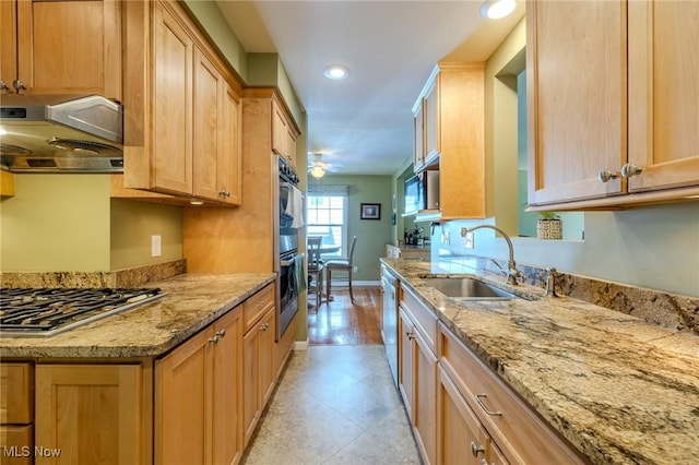 4959 Anderson Rd, Lyndhurst, OH 44124 - kitchen featuring appliances with stainless steel finishes, exhaust hood, light brown cabinets, light stone countertops, and a ceiling fan
