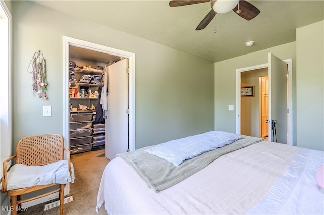 4959 Anderson Rd, Lyndhurst, OH 44124 - carpeted bedroom featuring a walk in closet and ceiling fan