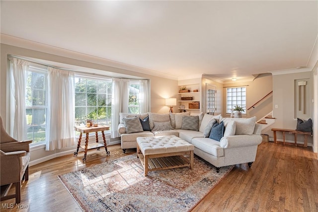 2383 Saybrook Rd, University Heights, OH 44118 - living area with ornamental molding, stairway, and wood finished floors