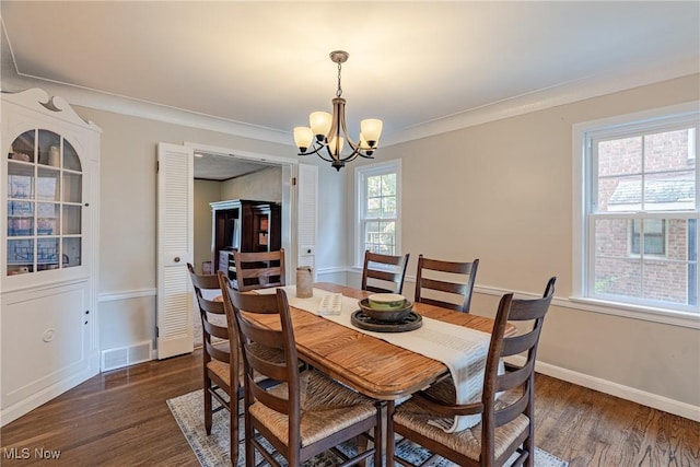 2383 Saybrook Rd, University Heights, OH 44118 - dining area with a chandelier, dark wood finished floors, and crown molding