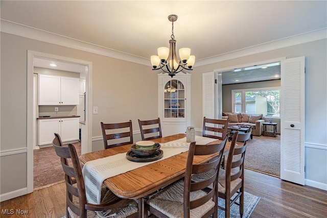 2383 Saybrook Rd, University Heights, OH 44118 - dining area featuring a chandelier, dark wood-style flooring, and crown molding