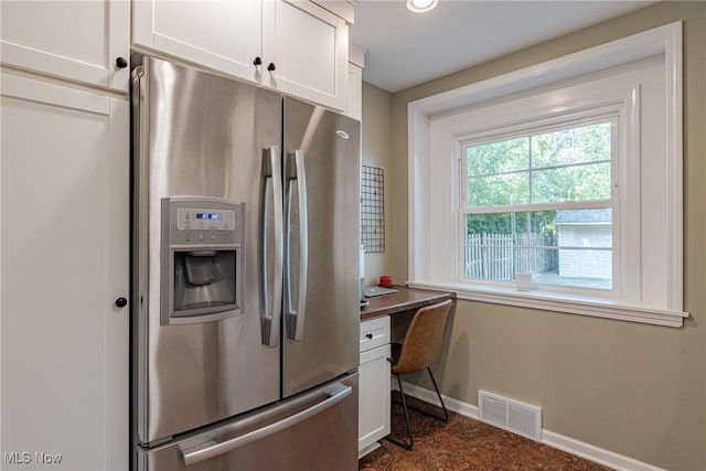 2383 Saybrook Rd, University Heights, OH 44118 - kitchen with stainless steel refrigerator with ice dispenser, white cabinetry, a desk, and dark countertops