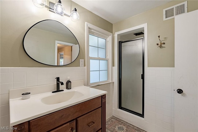 2383 Saybrook Rd, University Heights, OH 44118 - full bathroom featuring tile walls, vanity, a stall shower, and a wainscoted wall