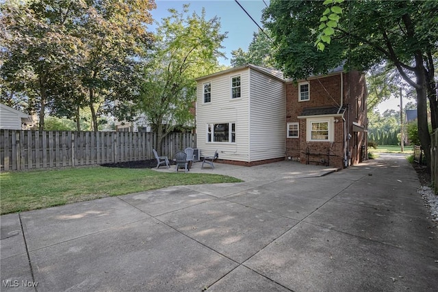 2383 Saybrook Rd, University Heights, OH 44118 - back of house with a patio, a fire pit, brick siding, and driveway