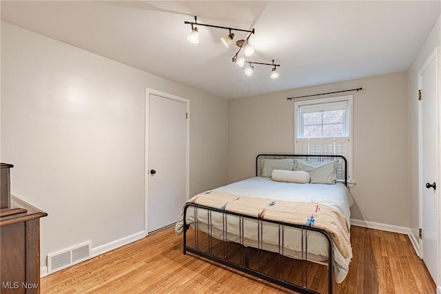 2383 Saybrook Rd, University Heights, OH 44118 - bedroom with rail lighting and light wood finished floors