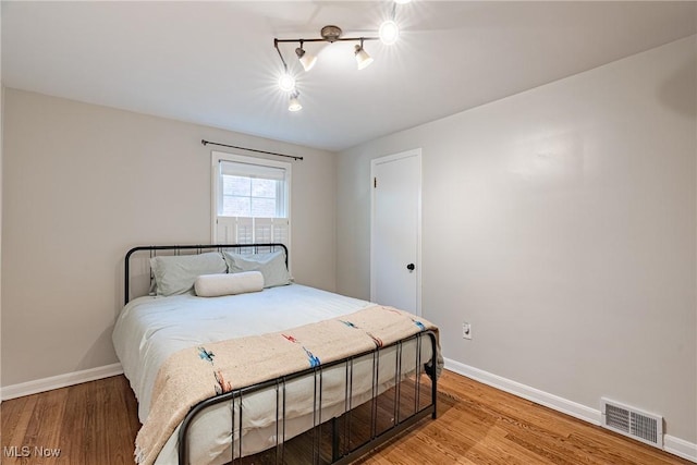 2383 Saybrook Rd, University Heights, OH 44118 - bedroom with light wood finished floors and rail lighting