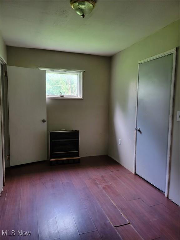 217 E 4th St, Warsaw, OH 43844 - unfurnished bedroom with wood finished floors