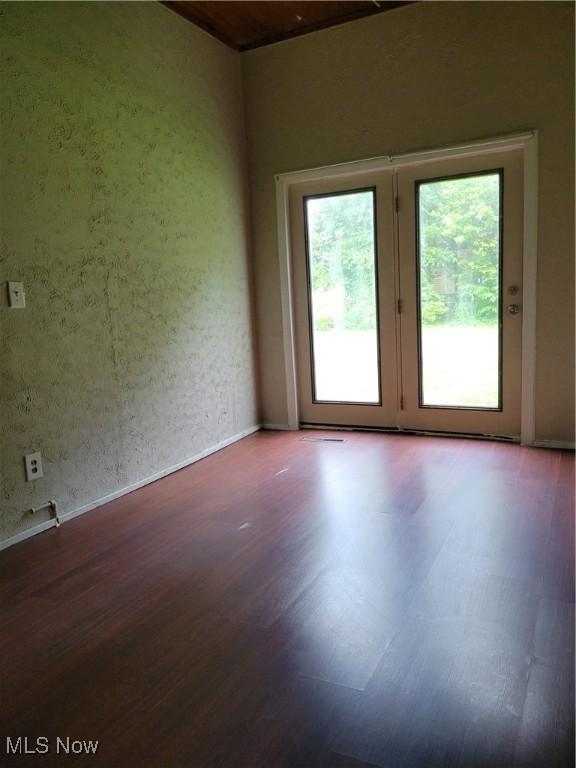 217 E 4th St, Warsaw, OH 43844 - empty room featuring wood finished floors and baseboards